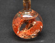 Bolita de vidrio rellena de cobre en láminas